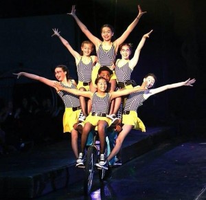 Freshman Marlo Graham on the bike top center). "Bike is scary to learn at first. You need to learn to work together and balance. It's my favorite act to perform in because it gets both you and the audience excited."