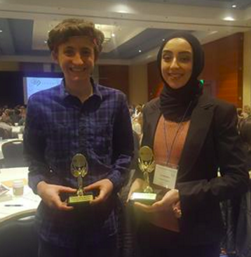 Juniors Iya Abdulkarim and Henry Zeitlow pose with their Seagate emerging scientist awards.