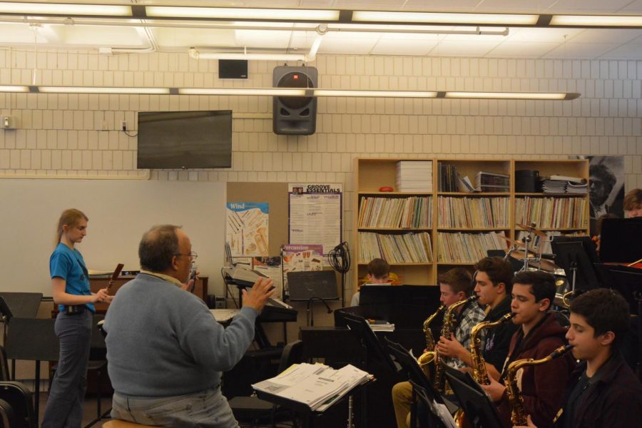 Director of Band Bill Mayson conducts a group of students in the jazz band.