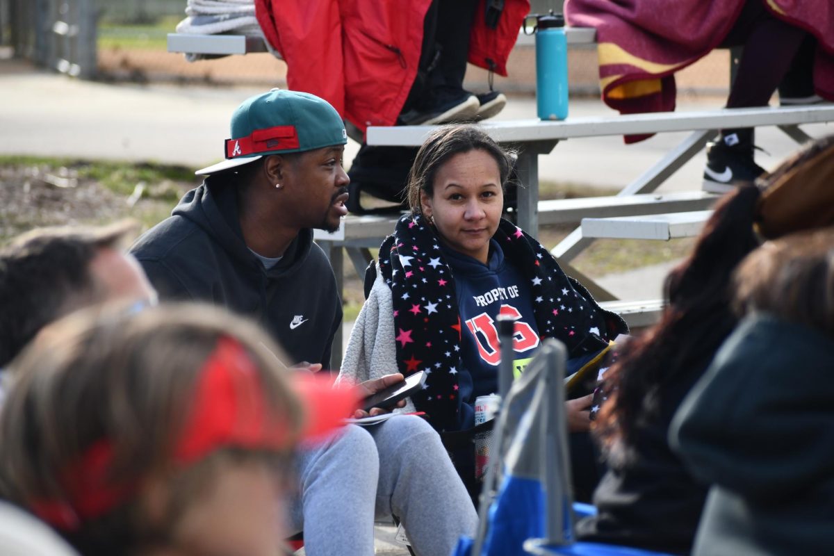 BIGGEST FANS. Parents Tabb and Kanysha Christopher, take the teams stats on paper and online. 