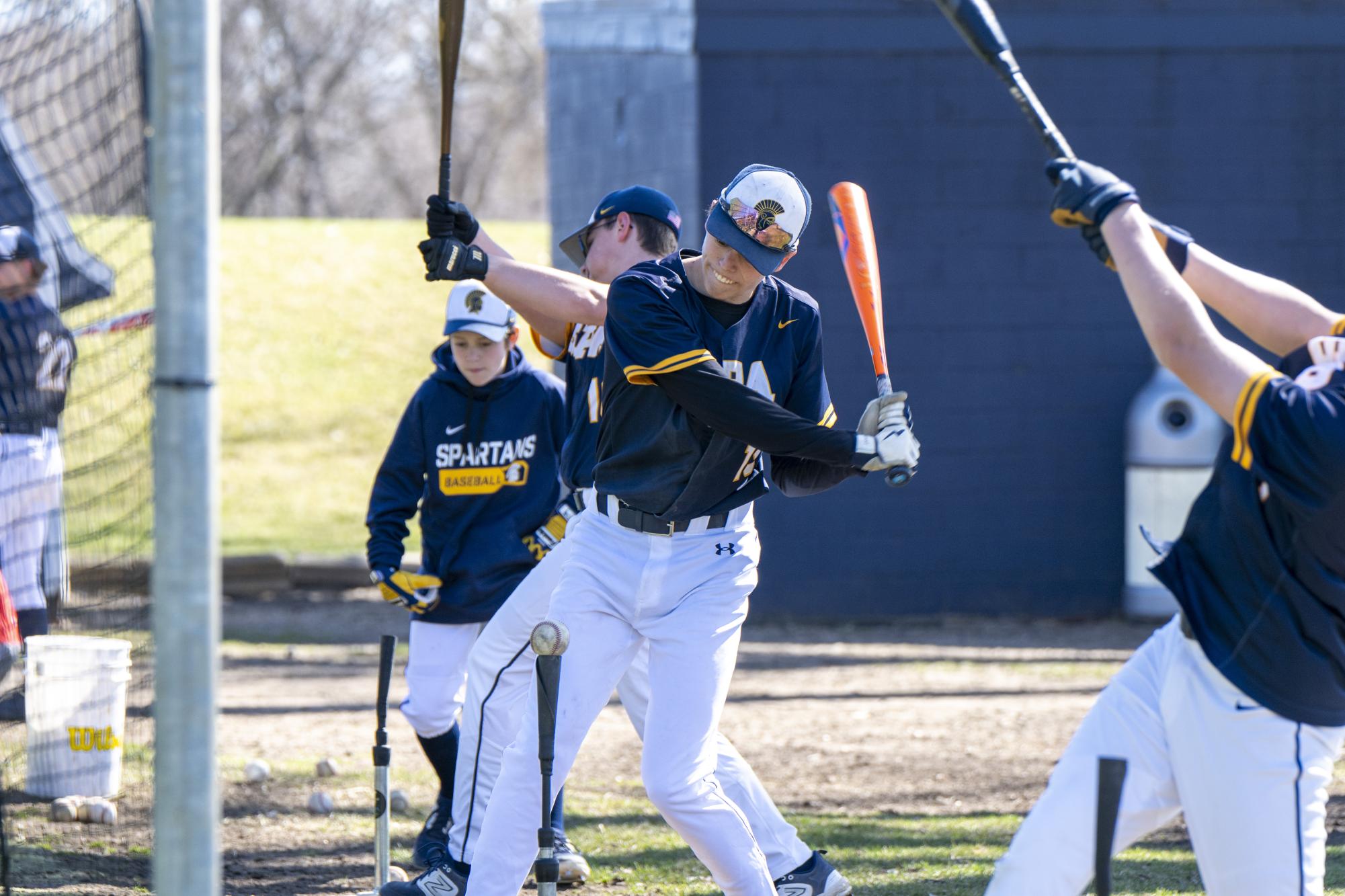 PRACTICE. Junior Liam Huddleston practices batting with the rest of the baseball team. "When I’m not playing well, I always try to focus on the next at-bat or play instead of getting caught up in my previous mistakes," he said.