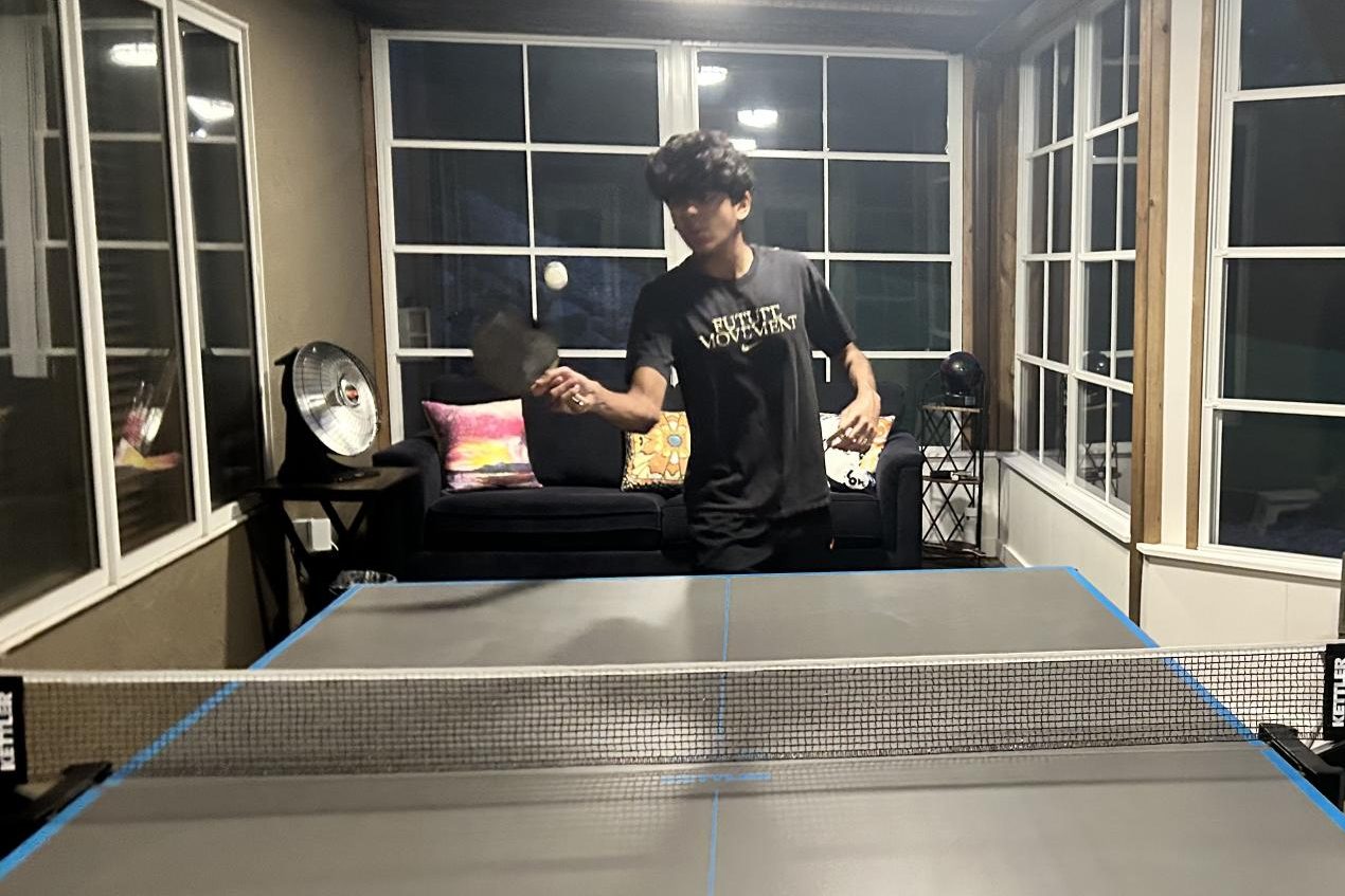 PRACTICE MAKES PERFECT. Ali Manzoor playing ping-pong in his house. When it comes to his strategy, “I prefer my backhand for sure, which is different than most people who play," he said. 