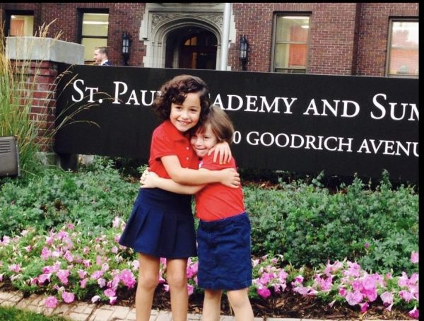 SINCE DAY ONE. Sofia Rivera and Margaret Bonin pose in front of the lower school building on the first day of kindergarten. 
