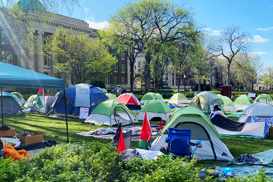 ACTIONS SPEAK. Tents on the Northrop Mall at the University of Minnesota on May 5. Sam Konstan (SPA ‘21), a U of M student, said, How much [the tent encampment] affects somebody’s day-to-day life is a combination of a choice and their schedule.“ However, he added, the discussions around [the protests] were a lot harder to avoid.” (Photo Reprinted with Permission from Winter Keefer, MinnPost)