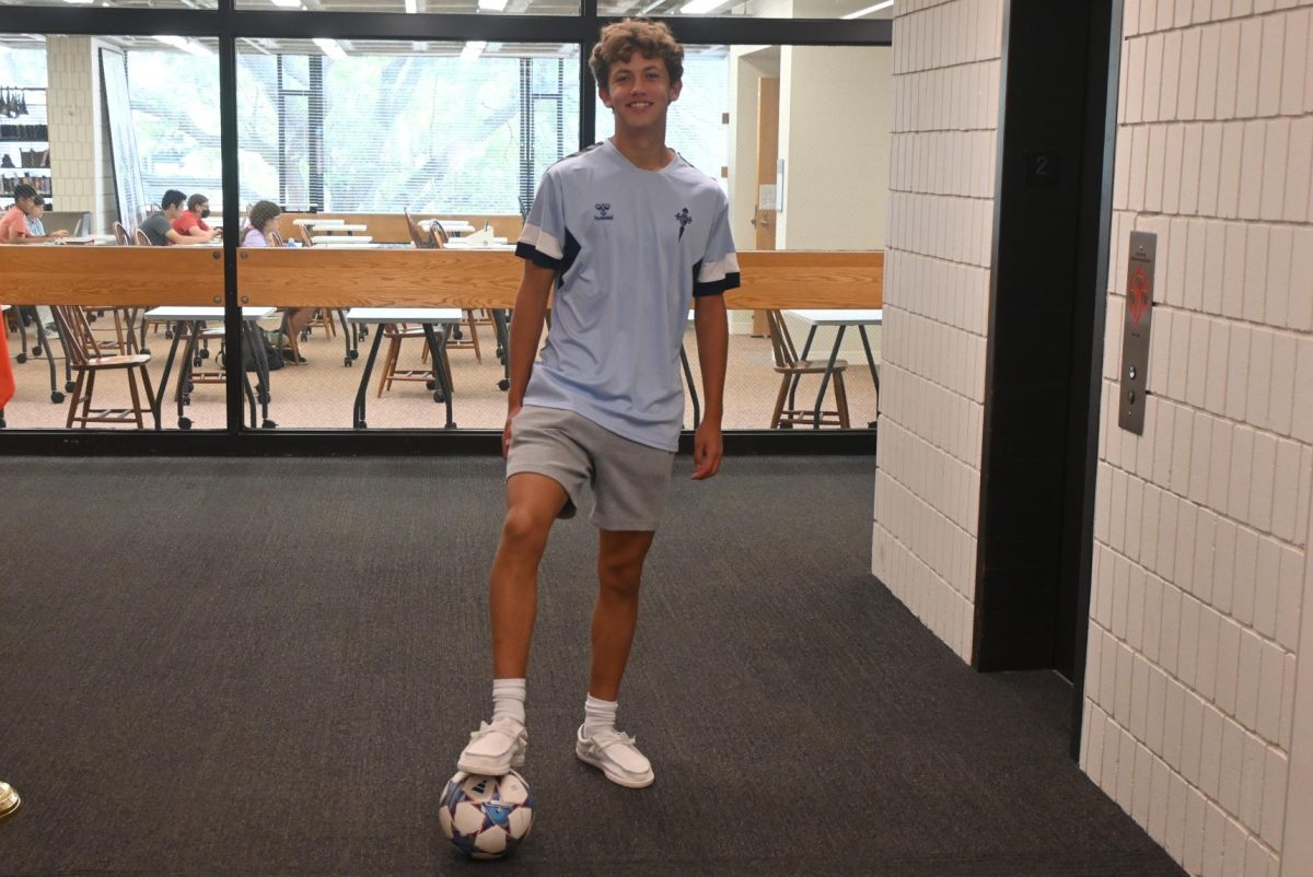 SIMPLE AND SPORTY. Junior Patrick Wall brought some international flair to his back to school outfit: "I got this jersey in Vigo, Spain [...] when I was there over the summer playing soccer." He compliments the jersey with simple clothing, prioritizing comfort "I've got some Nike Tech shorts that are really comfortable. Then I've got classic, regular white socks and Hey Dudes shoes in white. [They are] very nonchalant."