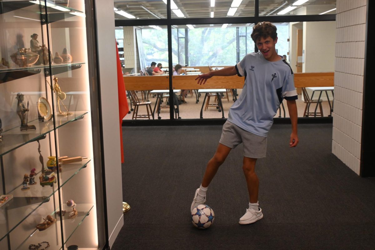 SIMPLE AND SPORTY. Junior Patrick Wall brought some international flair to his back to school outfit: "I got this jersey in Vigo, Spain [...] when I was there over the summer playing soccer." He compliments the jersey with simple clothing, prioritizing comfort "I've got some Nike Tech shorts that are really comfortable. Then I've got classic, regular white socks and Hey Dudes shoes in white. [They are] very nonchalant."