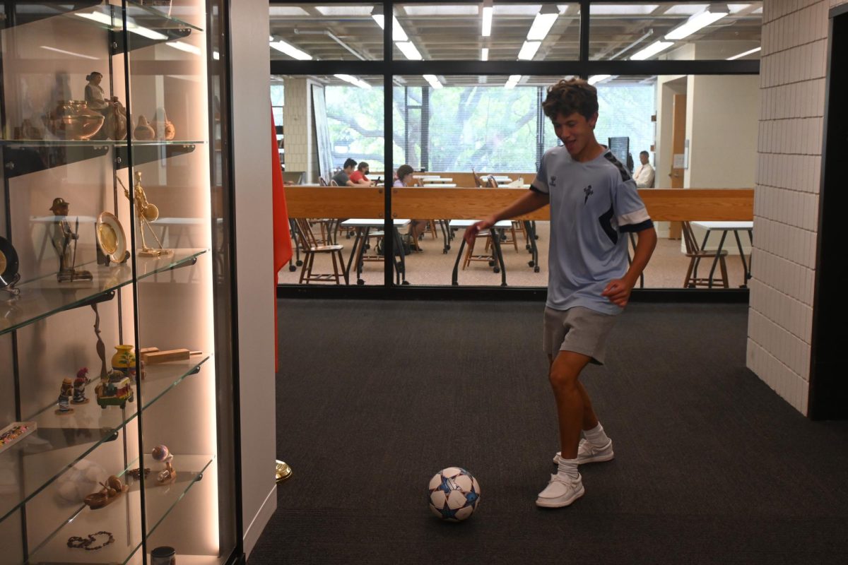 SIMPLE AND SPORTY. Junior Patrick Wall brought some international flair to his back to school outfit: "I got this jersey in Vigo, Spain [...] when I was there over the summer playing soccer." He compliments the jersey with simple clothing, prioritizing comfort "I've got some Nike Tech shorts that are really comfortable. Then I've got classic, regular white socks and Hey Dudes shoes in white. [They are] very nonchalant."