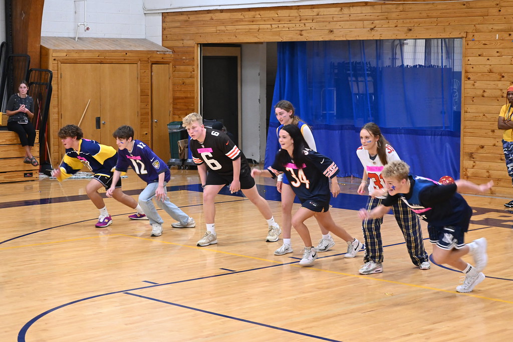 GO. "Roll Tide," a team comprised of juniors, rush to grab as many dodgeballs as they can.