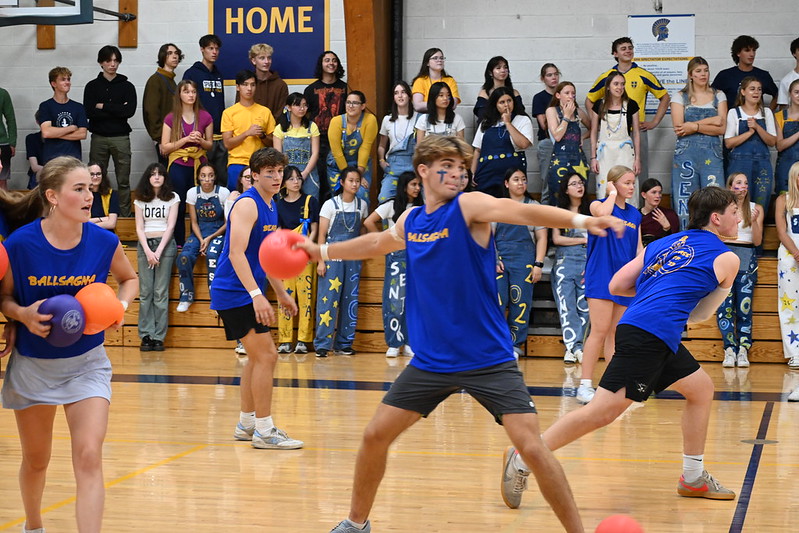 WIND UP. Senior Ethan Peltier prepares to throw a dodgeball at the faculty team.