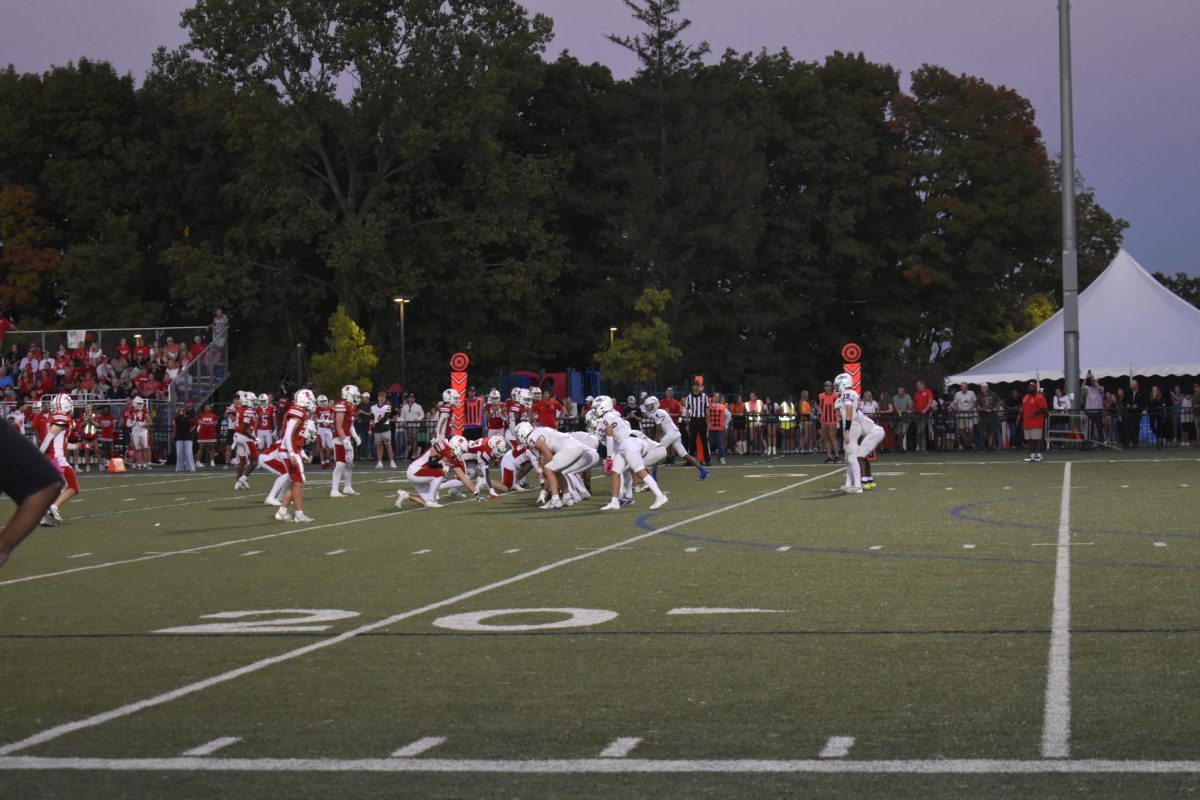 HIKE. The center is snaps the ball to the quarterback starting the Wolfpack's offense.