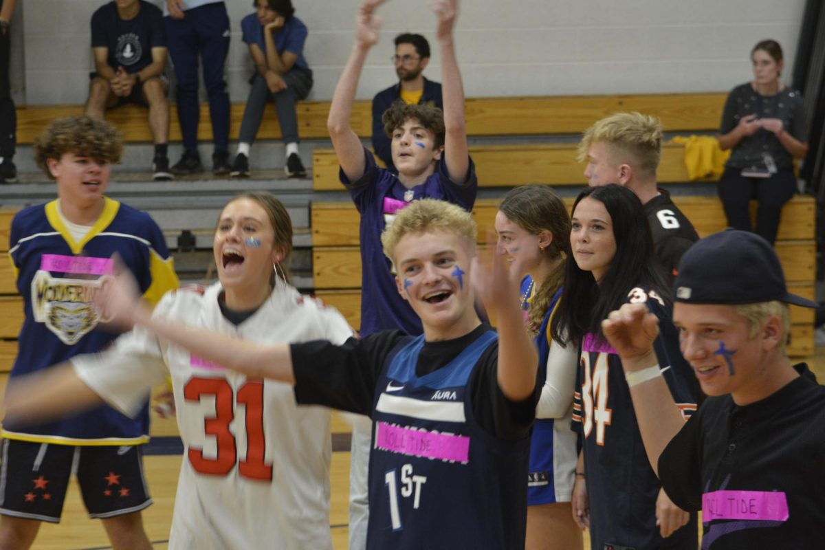 CROWD CONTROL. Dodgeball team Roll Tide calls for the support of their fellow juniors on the bleachers.