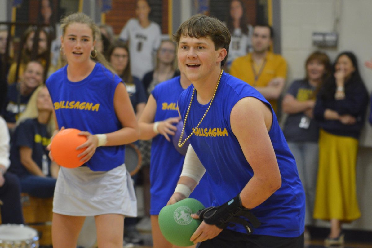 AGGRESSIVLEY SWEET. Seniors Taylor Barkwell and Dylan Bump observe the teachers's movements with amusement  before aiming their attacks.