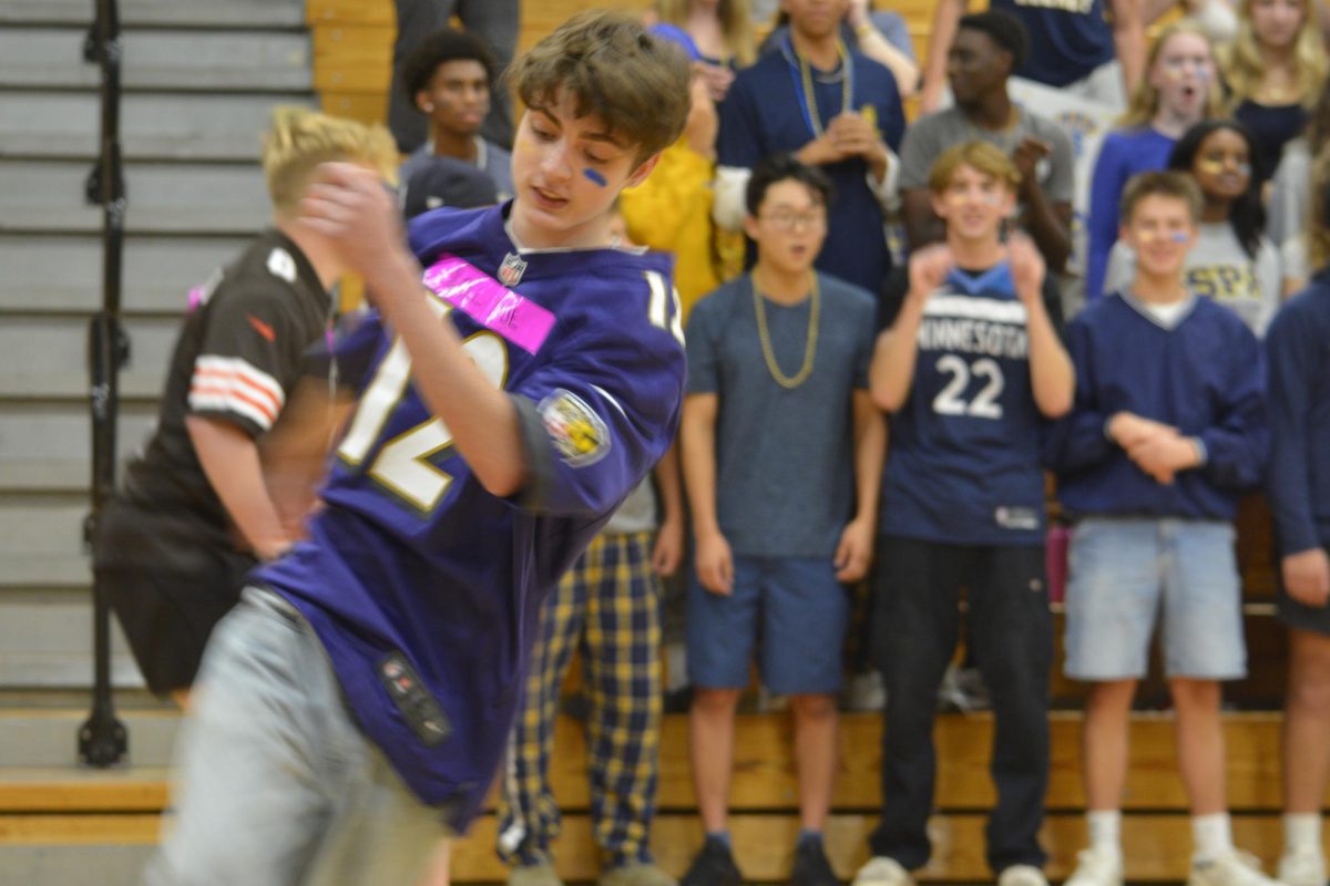 PUTTING THE DODGE IN DODGEBALL. Junior Eli Henretta from Roll Tide swiftly turns his body to avoid getting hit.