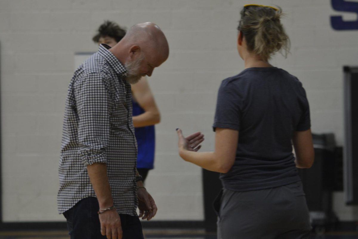 WALK OF SHAME. History teacher Ben Bollinger-Danielson walks off the court with his head hanging after being struck out.