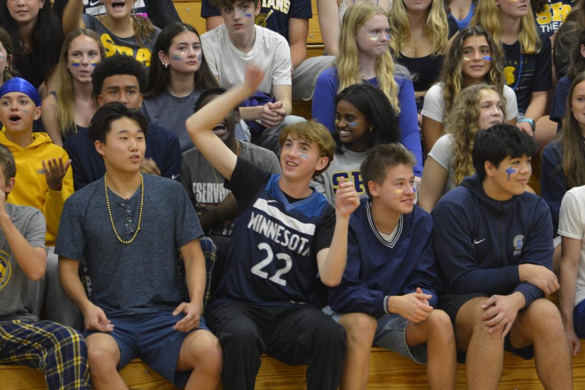 CHEER FOR THE UNDERDOG. Junior Andrew Lipinsky roots for the last one standing on the teachers's dodgeball team, Erin Ward.