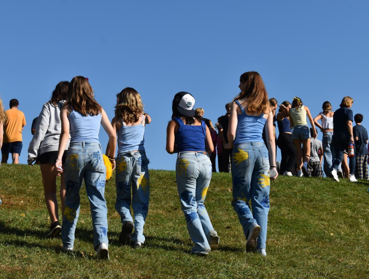 JAZZED-UP JEANS. Spartans wear matching jeans for the blue and gold theme on Friday.