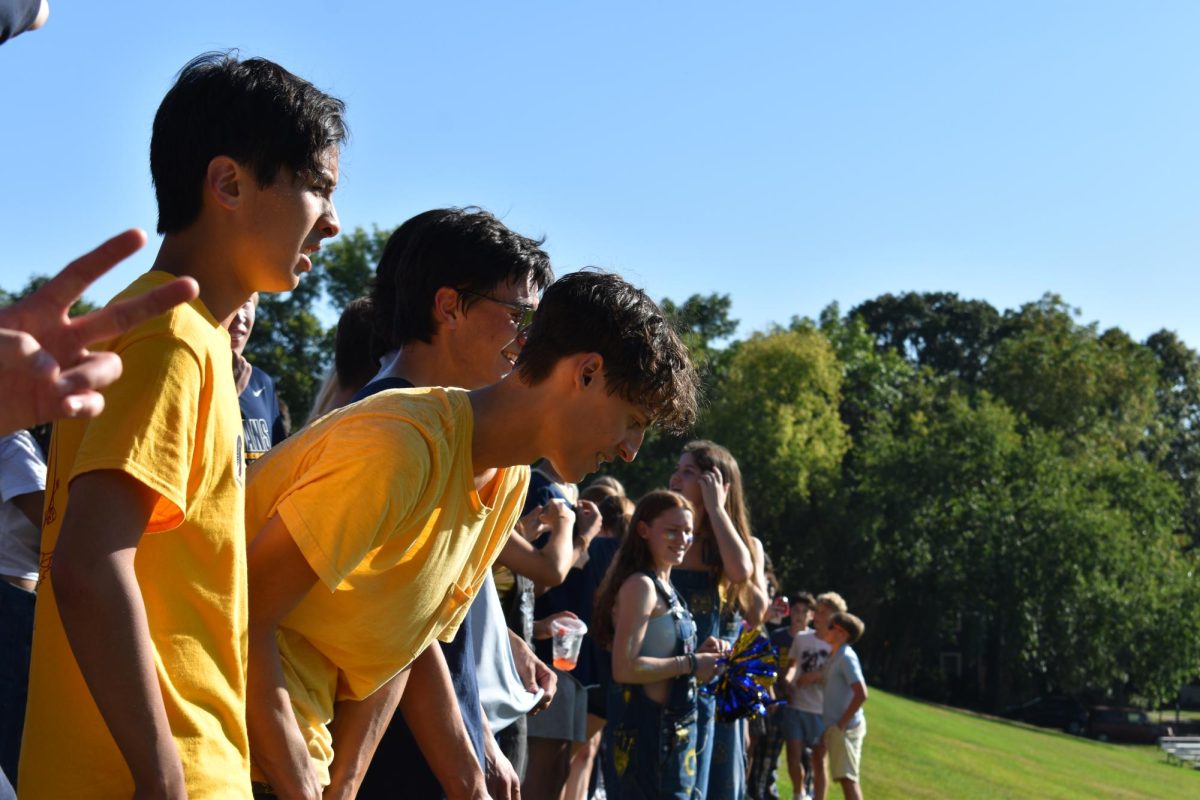 READY TO GO. Seniors Theo Su and Oliver Thompson line up for their last storming of the field.