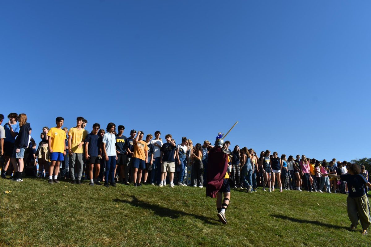 RALLY THE TROOPS. Senior Josh Holloway, decked out in full Spartan regalia, prepares to lead everyone down the hill.