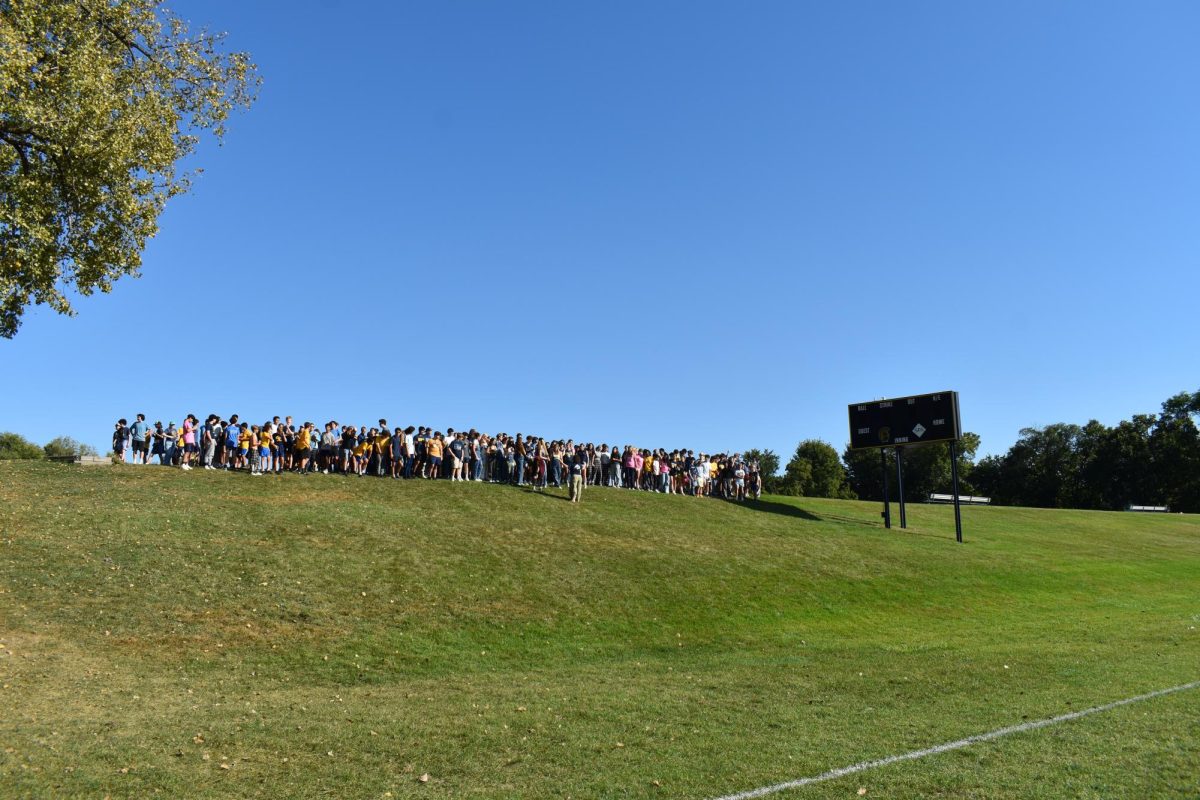 LINED UP. All students participating gather at the top of the hill and wait for the signal of this year's Spartan mascot.