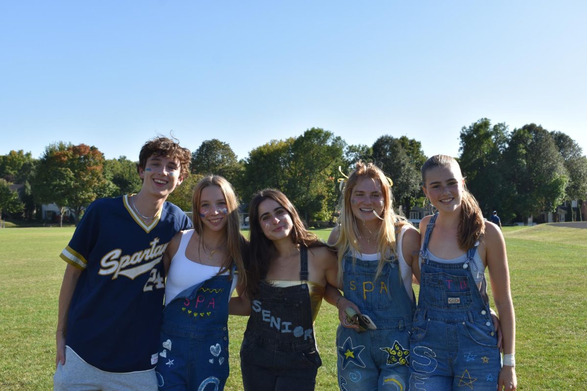 LAST HOMECOMING. Seniors Duncan Lang, Adele Gjerde, Georgia Ross, Annie Painter and Taylor Barkwell gather together after they storm the field for the last time.