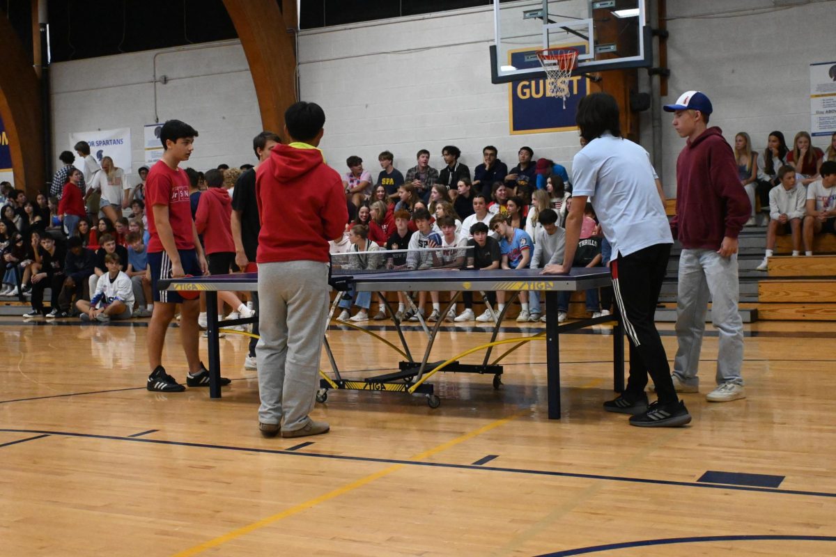 PING PONG FACE OFF. Seniors Ben Macedo and Aidan Williams face off against seniors Jacob Colton and Andrew Evans in a ping pong match.