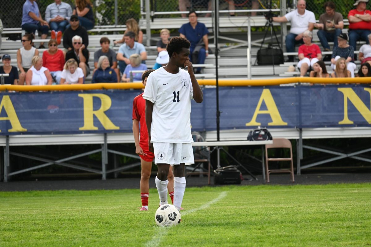 SECOND HALF. Straub stands on the ball, waiting for the queue to start playing.