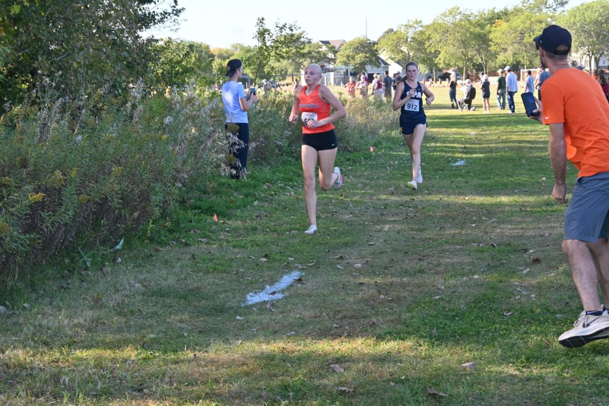 SPRINT. Senior Taylor Barkwell is on the heels of the second place runner.
