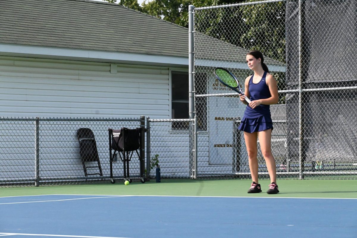 READY POSITION. Racket in-hand, Larson awaits the strong serve of her opponent. 