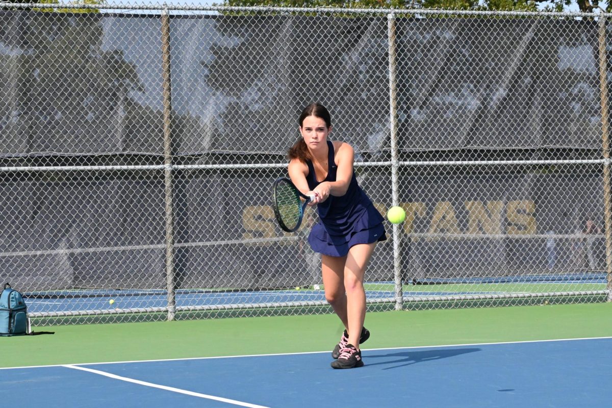 FOCUS. All of Larson's focus is on her return of the ball. 