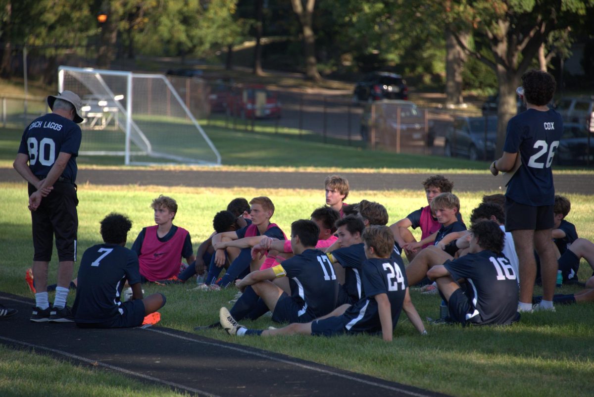 KEEP CONTROL. The team circles up during halftime to receive feedback from coaches. 