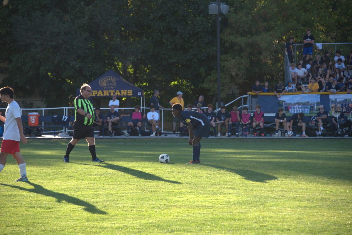 THINKING IT OUT. Senior Ezra Straub plans how to set up the team's next play