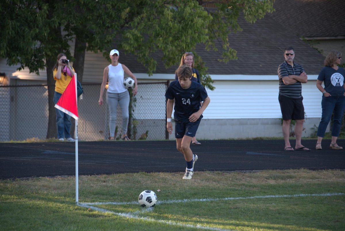 CORNER KICK. Sophomore Kiki Sullivan looks to kick the ball from the corner. 