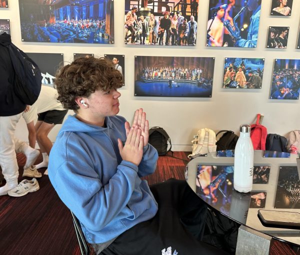 LOCKING IN. Junior Fletcher Coblentz listens to music throughout the day to get him in the right attitude for his role as a defensive lineman for SMB Wolfpack. "I listen to music with the intention of making sure I'm sufficiently aggressive," he said. 