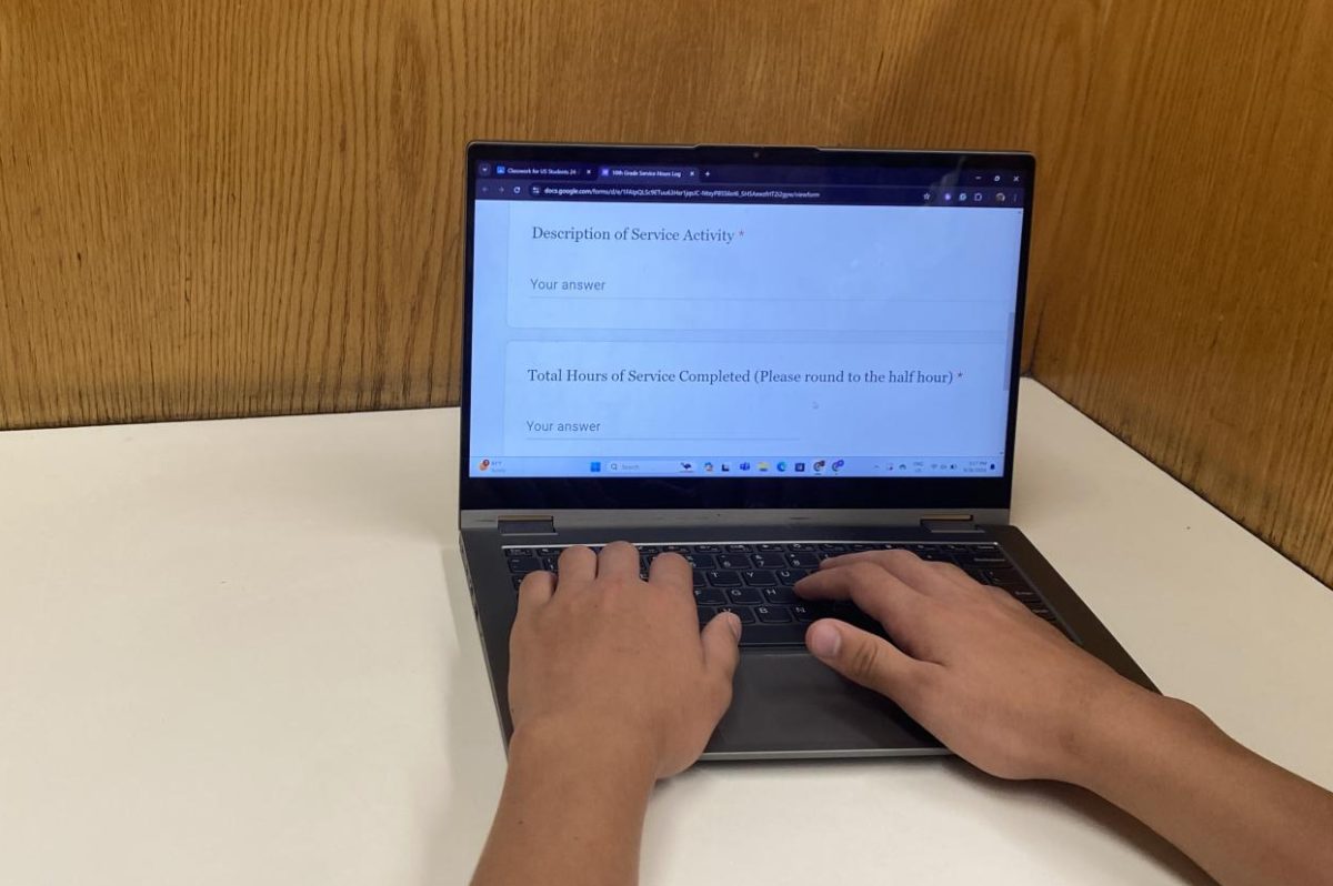 SERVICE TIME. A sophomore is shown logging their hours into the sophomore community service form. Sophomores are supposed to log hours into a Google form, citing what work they did and the number of hours completed.