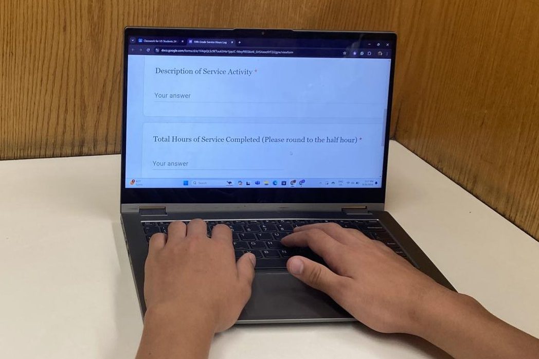 SERVICE TIME. A sophomore is shown logging their hours into the sophomore community service form. Sophomores are supposed to log hours into a Google form, citing what work they did and the number of hours completed.