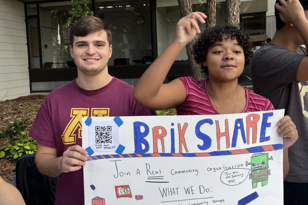 CLUB FAIR. Senior Bora Mandic (left) and sophomore January Cook (right) promote Brikshare at the club fair. “We're trying to build a team here at SPA… Because, at the moment, it's just me and Bora," Cook said.