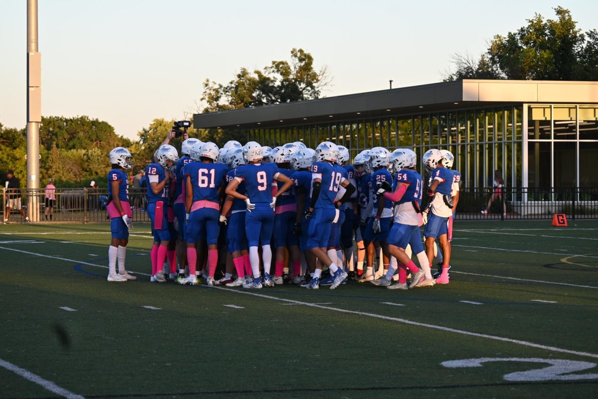 HUDDLE UP. The Wolfpack dominate the field as they stand together before taking on the Stars. 