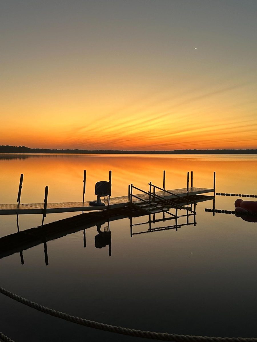 A SUNSET TO REMEMBER. The sun is setting beautifully over the local lake next to the camp. Campers often spend a lot of time on this dock during the summer but not only for the sunset. “We have this, inflatable kind of obstacle course, which is called gary land, because he is the main caretaker of the land” Gardner said.