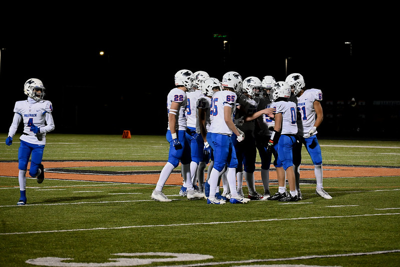 WHAT'S THE PLAY. The Wolfpack huddles together on the field to talk strategy after the Tigers scored a touchdown. 