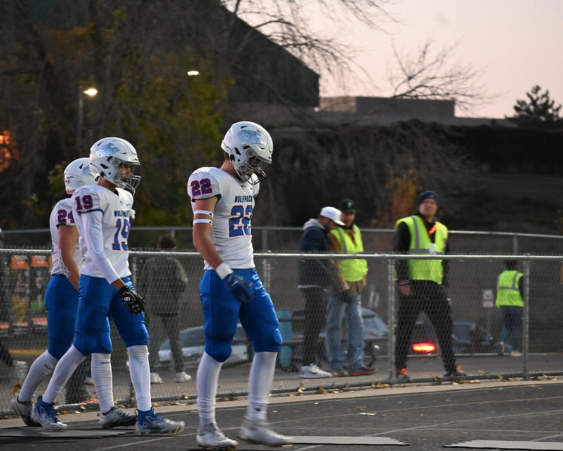 WALK OUT. The team walks out for their final match before the section tournament. The team dons white jerseys and blue pants complete with red detailing. 