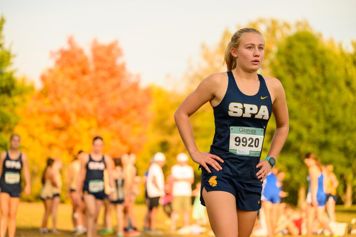 RACE READY. Junior Maren Overgaard uses mantras or little phrases to keep her going when running. "I like to repeat little things in my head, because I get really focused on splits, where I am in the race and who's next to me and all that stuff," she said. The term "splits" refers to the time it takes a runner to complete a specific distance within a race. (SPA SmugMug).