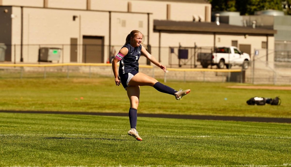 PERFECT KICK. Forward Sawyer Bollinger-Danielson kicks the ball with power before the game.