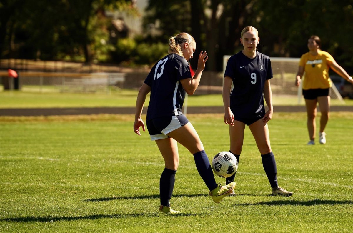 PREGAME. Midfielder Sofia Johnson and Defender Mia Collins value their pregame warmups.  