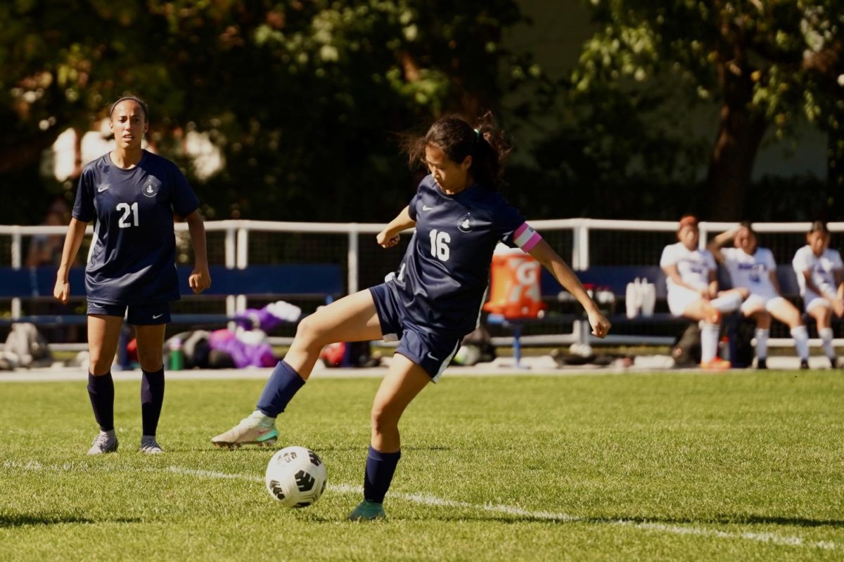 PROTECT. Defender Annie Zhang secures the ball from the other team.