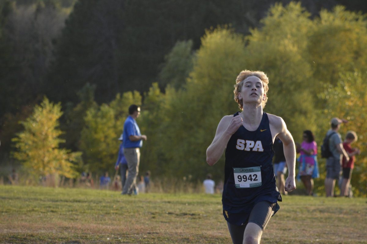 ALMOST THERE. As he nears the finish-line, senior Finn Miller-Fimpel pushes himself to end strong.