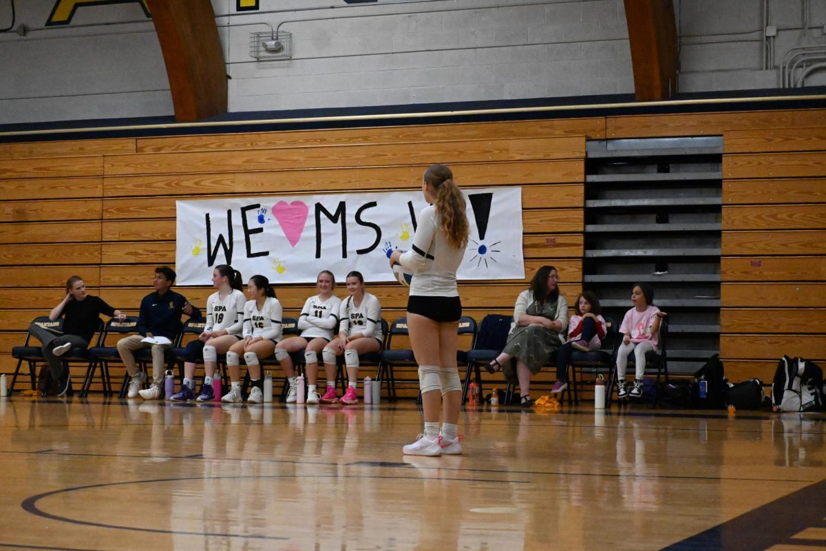 CALM. Right side hitter Nora McKoy holds the ball calmly while waiting for her turn to serve