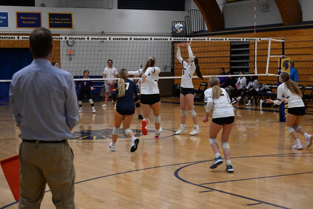 PERFECT SET. Setter Lucy Thomas sets the ball perfectly for middle Olympia Wolff