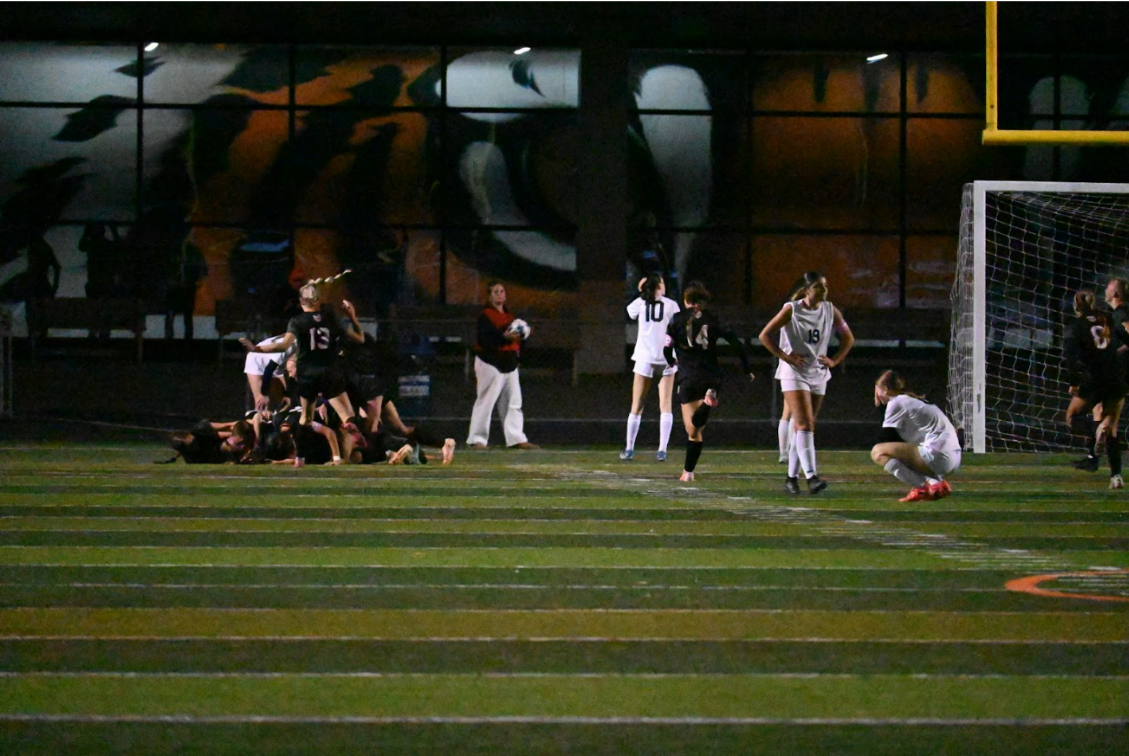 GVS players stand by with their heads down as St. Charles celebrates their 1-0 win. After a scoreless last ten minutes, the game went to overtime, and the Saints were able to get a shot off after some quick passes found the Spartans retreating on defense. The ball found the back of the net and marked the end of the GVS soccer season and the last game for all of the Spartan seniors.