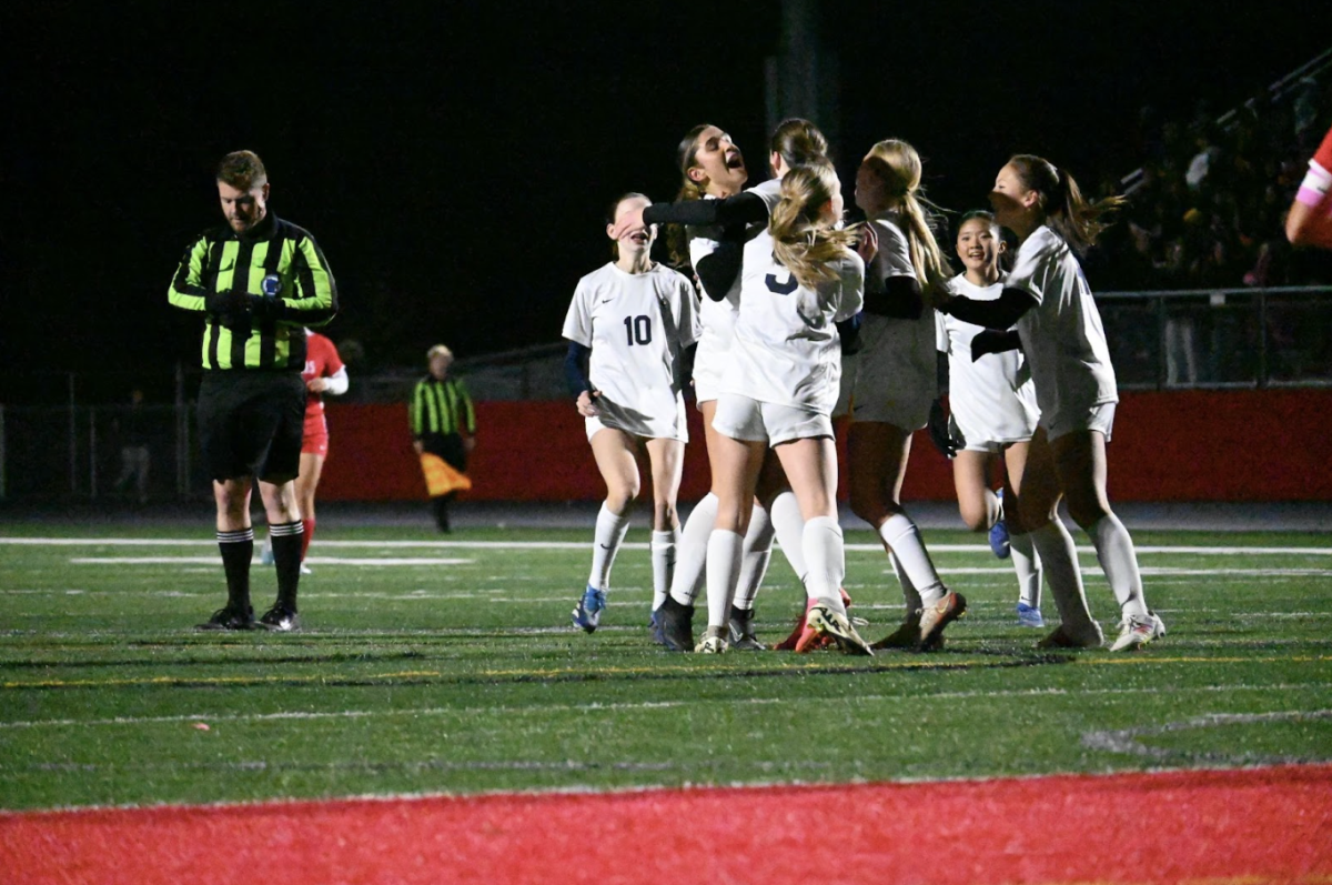 GROUP HUG. Captain Lucia Gonzalez jumps up to celebrate with goal scorer Clare Ryan-Bradley as the rest of the team rushes in to join.