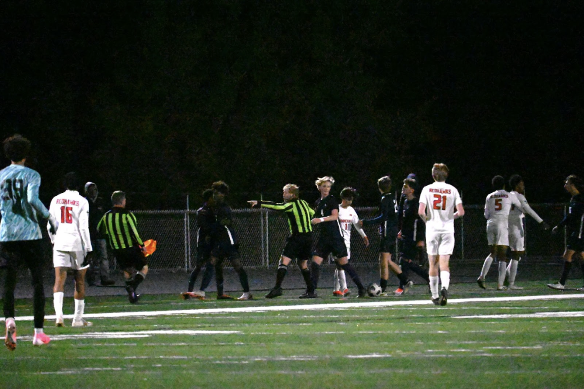 SENT OFF. Senior Mas Kouakou is kicked out of the game by the referee with a straight red card. Kouakou was ejected after retaliating after a foul, meaning he will have to miss the Spartans’ first game of the state tournament.